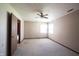 Spacious bedroom with two windows, ceiling fan, and access to the ensuite bathroom at 562 Monte Vista Dr, Greenwood, IN 46143