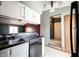 Kitchen showcasing the dark countertops, a stainless sink, and a dishwasher at 562 Monte Vista Dr, Greenwood, IN 46143