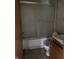 Bathroom featuring tub, shower, toilet and vanity, providing essential amenities at 5810 Greenfield Ave, Indianapolis, IN 46219