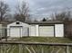 A detached two car garage with a side door is perfect for storage and keeping vehicles out of the elements at 5810 Greenfield Ave, Indianapolis, IN 46219