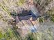 Overhead shot of a home featuring a brown roof, complemented by a surrounding landscape of bare trees at 5917 Camelback Ct, Indianapolis, IN 46250
