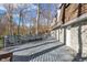 Large back deck with benches providing a tranquil space surrounded by mature trees and natural light at 5917 Camelback Ct, Indianapolis, IN 46250