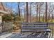 Back deck with built-in seating and wooded views, creating a serene outdoor experience at 5917 Camelback Ct, Indianapolis, IN 46250