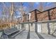Extensive back deck with built-in seating, perfect for outdoor entertaining with stone and brick accents at 5917 Camelback Ct, Indianapolis, IN 46250