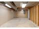 Spacious unfinished basement featuring concrete flooring and walls, offering potential for customization at 5917 Camelback Ct, Indianapolis, IN 46250