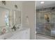 Elegant bathroom with double vanity, marble countertops, and a glass-enclosed shower at 5917 Camelback Ct, Indianapolis, IN 46250