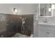 Stylish bathroom with modern fixtures, shower with decorative tile, and sleek vanity at 5917 Camelback Ct, Indianapolis, IN 46250