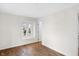 Bright bedroom with a window overlooking the outdoors and hardwood floors at 5917 Camelback Ct, Indianapolis, IN 46250