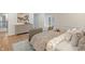 Relaxing bedroom with hardwood floors, dresser, natural light, and calming decor at 5917 Camelback Ct, Indianapolis, IN 46250