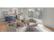 Bright living area with access to deck, featuring a seamless flow to the modern kitchen at 5917 Camelback Ct, Indianapolis, IN 46250