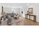 Elegant living room features a large sectional sofa and neutral decor with lots of natural light at 5917 Camelback Ct, Indianapolis, IN 46250