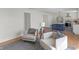 Inviting living room with hardwood floors, neutral palette, and an open layout to the kitchen at 5917 Camelback Ct, Indianapolis, IN 46250
