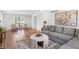 Spacious living room featuring a sectional sofa, hardwood floors, and natural light at 5917 Camelback Ct, Indianapolis, IN 46250