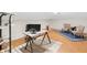 Home office space with modern desk, natural light, hardwood floors and blue area rug at 5917 Camelback Ct, Indianapolis, IN 46250