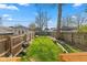 Spacious, fenced backyard with a grill, tree, and ample space for gardening or recreation at 601 Wallace Ave, Indianapolis, IN 46201