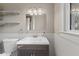 Bathroom showcases a dark vanity and light fixtures, complete with a functional toilet at 601 Wallace Ave, Indianapolis, IN 46201