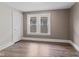 Bright bedroom filled with natural light and showcasing upgraded flooring and freshly painted walls at 601 Wallace Ave, Indianapolis, IN 46201