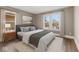 Cozy bedroom with a neutral color scheme, natural light, and hardwood floors at 601 Wallace Ave, Indianapolis, IN 46201