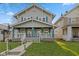 Charming two-story home featuring a welcoming front porch and classic architectural details at 601 Wallace Ave, Indianapolis, IN 46201
