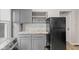 Functional kitchen with cabinets, appliances, and counter space, plus laundry area at 601 Wallace Ave, Indianapolis, IN 46201