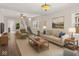 Bright living room with hardwood floors, a neutral color palette, and a staircase at 601 Wallace Ave, Indianapolis, IN 46201
