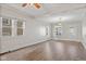Bright living room featuring gleaming hardwood floors, large windows, and an inviting open space at 601 Wallace Ave, Indianapolis, IN 46201