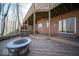 View of the back deck with an outdoor fire pit and stairs leading to the backyard at 6013 Yellow Birch Ct, Avon, IN 46123