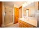 Updated bathroom featuring tile flooring, white shower, and a wood cabinet at 6013 Yellow Birch Ct, Avon, IN 46123