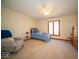 Bedroom with neutral carpet and tones, a large window and a comfortable reading chair at 6013 Yellow Birch Ct, Avon, IN 46123