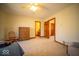 Bedroom with neutral carpet and tones, large window, and access to other parts of the home at 6013 Yellow Birch Ct, Avon, IN 46123