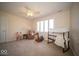 Bedroom showcasing a crib, chair, rocking horse and side table next to a window at 6013 Yellow Birch Ct, Avon, IN 46123