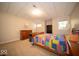 Cozy bedroom with a colorful quilt, dresser, bookshelf, and a neutral color scheme at 6013 Yellow Birch Ct, Avon, IN 46123