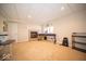 Bonus room with a fireplace, musical instruments, carpeted floors, and natural light from the window at 6013 Yellow Birch Ct, Avon, IN 46123