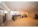 Bonus room with a fireplace, musical instruments, carpeted floors, and natural light from the window at 6013 Yellow Birch Ct, Avon, IN 46123