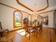 Formal dining room featuring a chandelier and a view of the front yard at 6013 Yellow Birch Ct, Avon, IN 46123