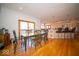 Open dining area with hardwood floors connecting to the kitchen and breakfast area at 6013 Yellow Birch Ct, Avon, IN 46123