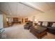 A living room with a comfortable seating area, a pool table, and access to the outside at 6013 Yellow Birch Ct, Avon, IN 46123
