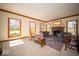 Bright living room featuring a fireplace and multiple windows for natural light at 6013 Yellow Birch Ct, Avon, IN 46123