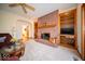 Spacious living room includes brick fireplace with mantle and custom built-in bookcases at 6013 Yellow Birch Ct, Avon, IN 46123