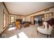 Spacious living room with fireplace, large windows, and classic trim at 6013 Yellow Birch Ct, Avon, IN 46123