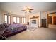Bright main bedroom with large windows, fireplace, and access to the rest of the home at 6013 Yellow Birch Ct, Avon, IN 46123