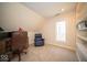 Home office with built-in shelves, a comfortable chair, and a window with scenic views at 6013 Yellow Birch Ct, Avon, IN 46123