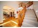 Staircase with hardwood floors and chandelier in adjacent Dining Room at 6013 Yellow Birch Ct, Avon, IN 46123