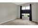 Bedroom with carpet flooring, window, and neutral paint at 6026 Rockdell Dr, Indianapolis, IN 46237