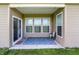 A covered patio with sliding doors and large windows, creating a relaxing outdoor living space at 6026 Rockdell Dr, Indianapolis, IN 46237