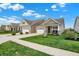 Well-manicured lawns enhance the curb appeal of these lovely single-Gathering homes in this charming neighborhood at 6026 Rockdell Dr, Indianapolis, IN 46237