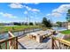 A backyard wooden deck that has benches, a fire pit, pond and nice view at 6026 Sally Ann Cir, Indianapolis, IN 46237
