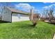 Large backyard featuring a wooden deck, patio, and lush green lawn, perfect for outdoor enjoyment and entertaining at 6026 Sally Ann Cir, Indianapolis, IN 46237