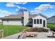 A view of a home's backyard with a wooden deck, landscaping and nice lawn at 6026 Sally Ann Cir, Indianapolis, IN 46237