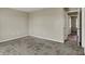 Neutral carpeted bedroom with an open door and light-colored walls at 6026 Sally Ann Cir, Indianapolis, IN 46237